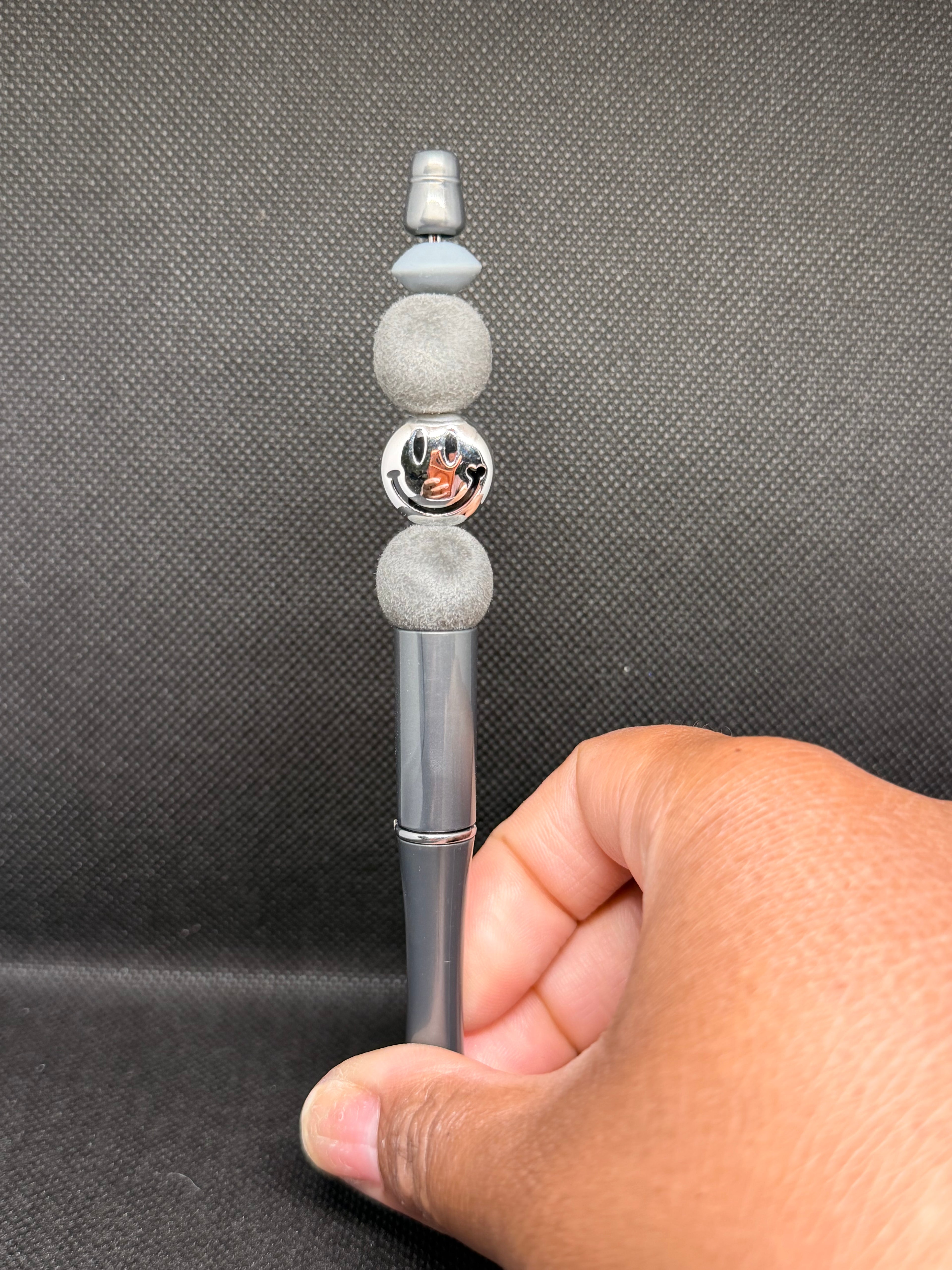 Silver smiley face pen